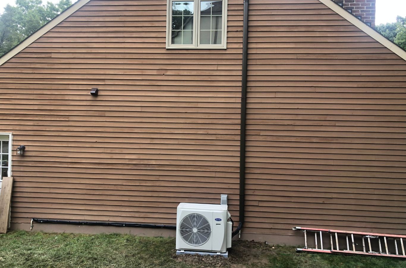 A Climate Systems team member installing an energy-efficient HVAC system in Adams Township, PA, ensuring reliable performance for local clients.