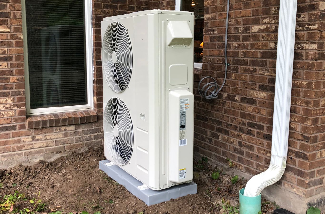 A Climate Systems team member installing a modern HVAC system in McCandless, PA, showcasing efficient and reliable solutions.