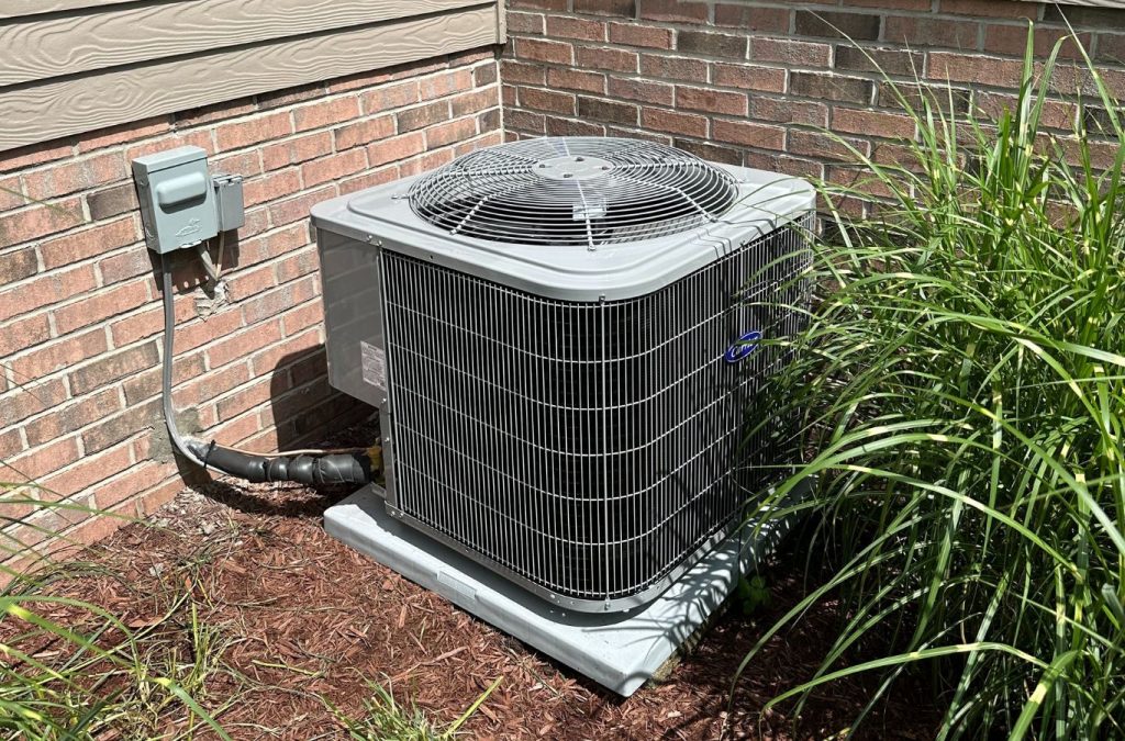 A Climate Systems technician providing expert HVAC services in Cranberry Township, PA, using professional tools to ensure optimal performance.