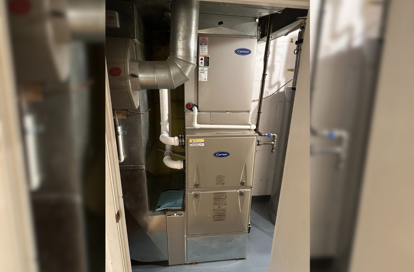 A Climate Systems Air Conditioning & Heating team member diagnosing a furnace in Seven Fields, PA, demonstrating expert repair services.