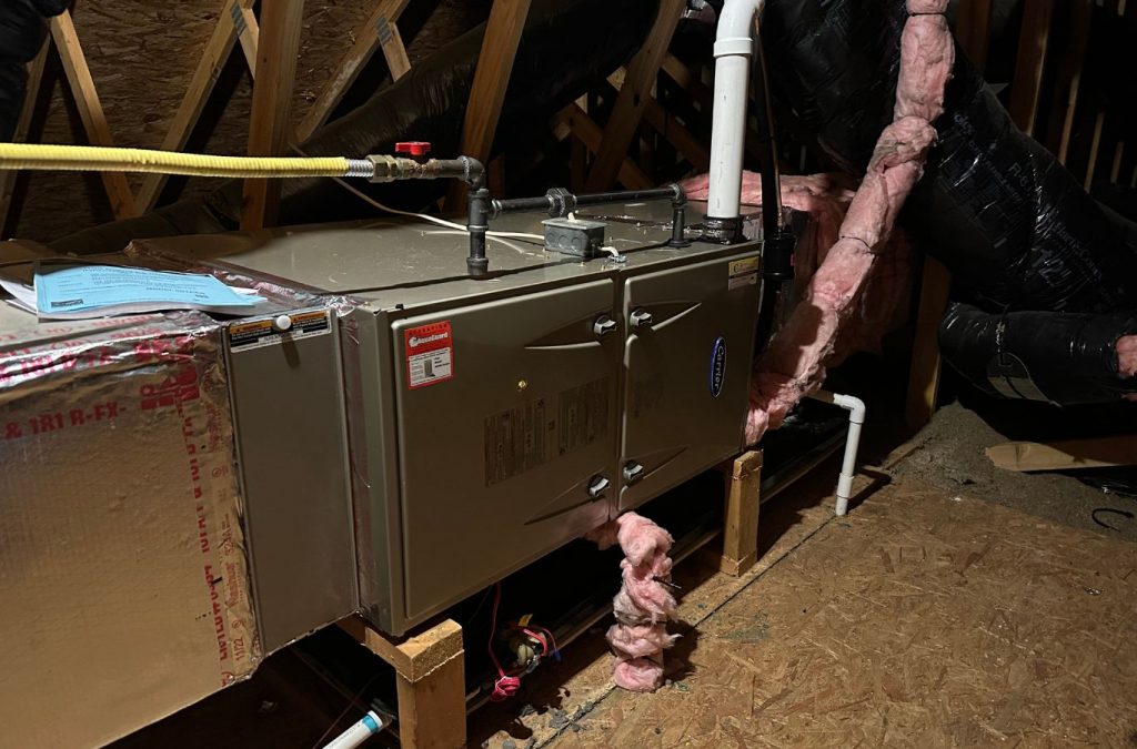 A Climate Systems Air Conditioning & Heating technician repairing a furnace in Mars, PA, ensuring efficient heating for a homeowner.