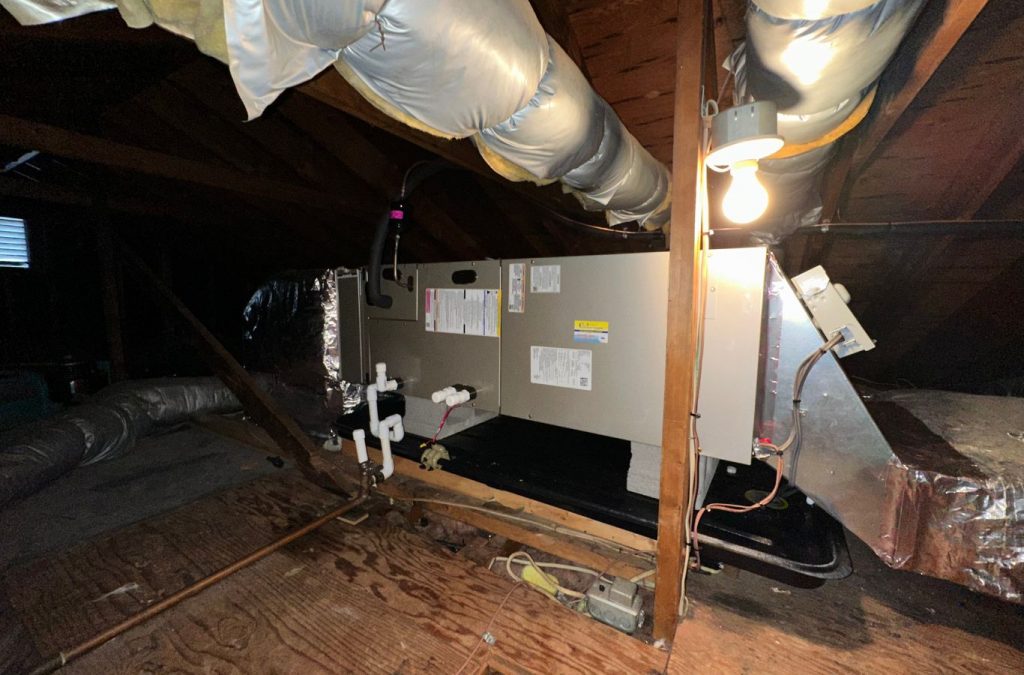 A Climate Systems Air Conditioning & Heating technician performing furnace repair in Seven Fields, PA, ensuring reliable heating for a homeowner.