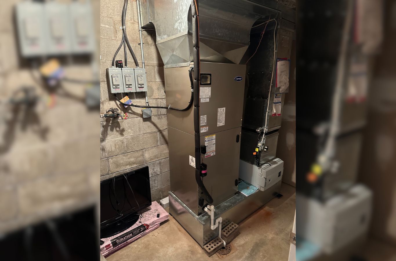 A skilled Climate Systems Air Conditioning & Heating technician fixing a furnace in Mars, PA, ensuring high-quality service and reliability. Furnace Repair near me.