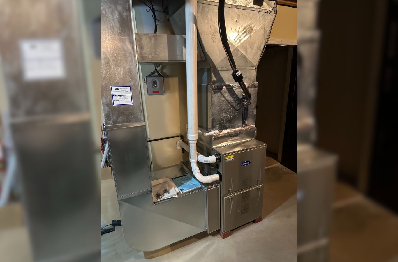 A skilled Climate Systems Air Conditioning & Heating expert fixing a heating system in Seven Fields, PA, ensuring quality and efficiency. Furnace Repair near me.