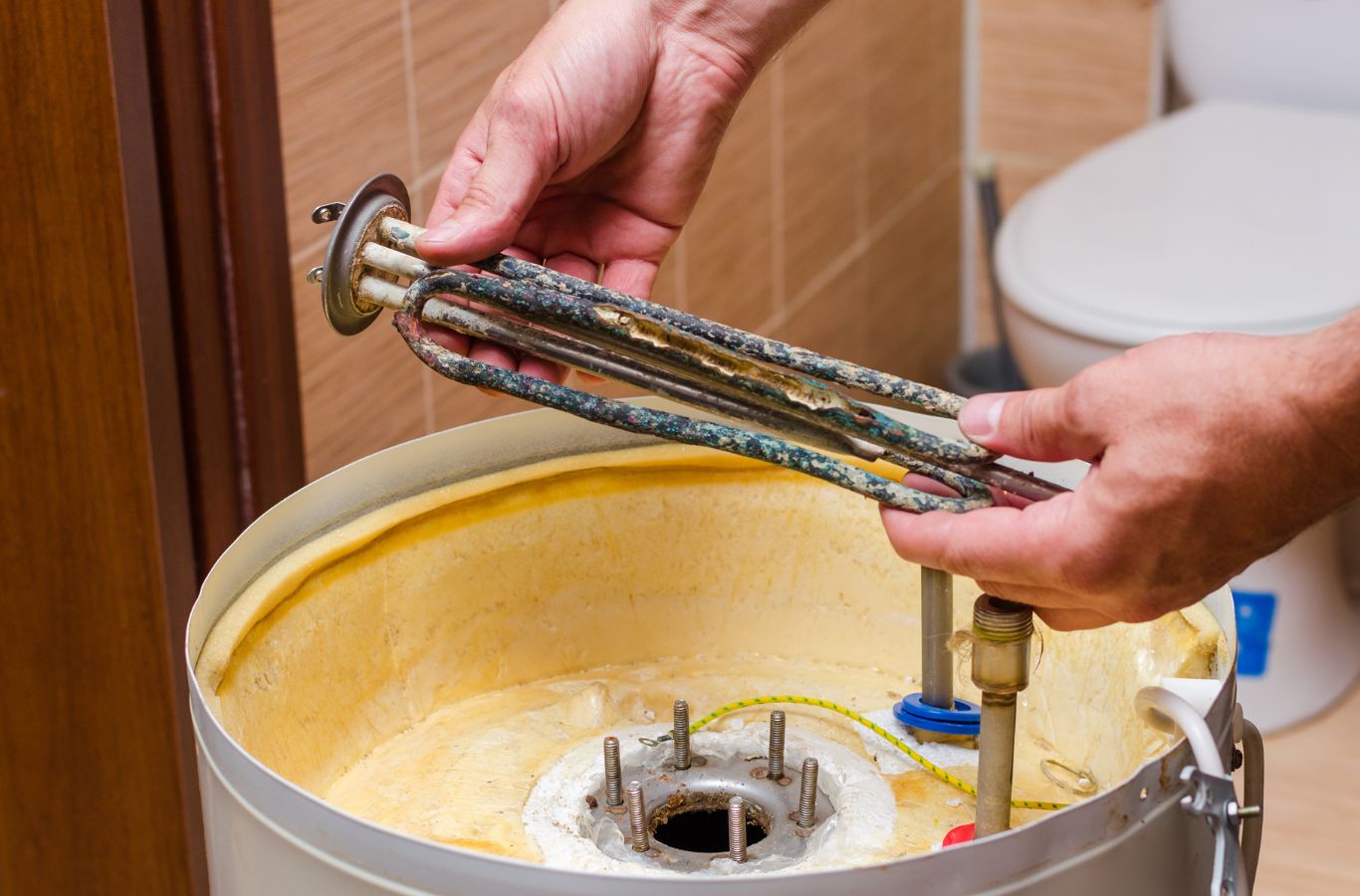 A skilled Climate Systems technician inspecting a boiler in Adams Township, PA, demonstrating expert care and precision. Boiler Repair near me.