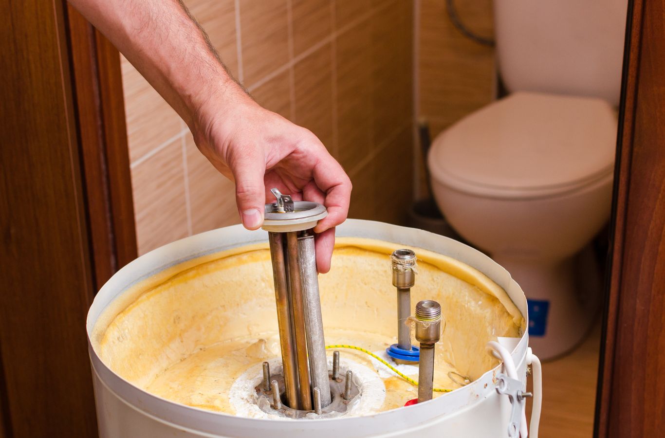 A skilled Climate Systems technician working on a boiler in Cranberry Township, PA, highlighting expert service and efficiency. Boiler Repair near me.